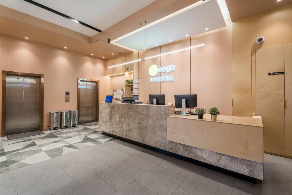 Reception and elevator lobby self-service desk and secure keycard elevator at Shanghai Meego Hotel